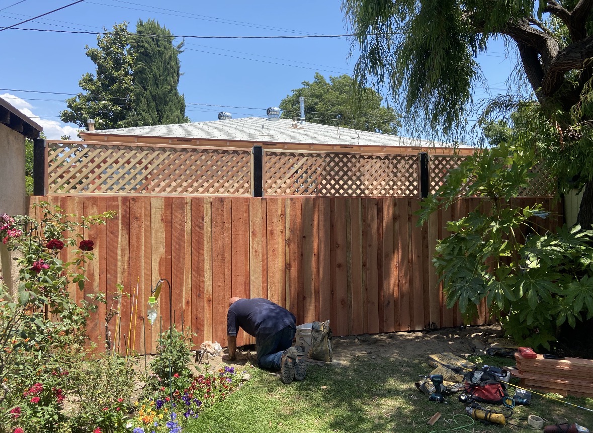 Wood fence installation with a lattice top