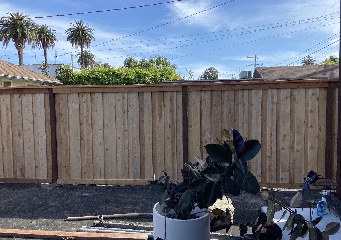 Backyard vertical wood privacy fence