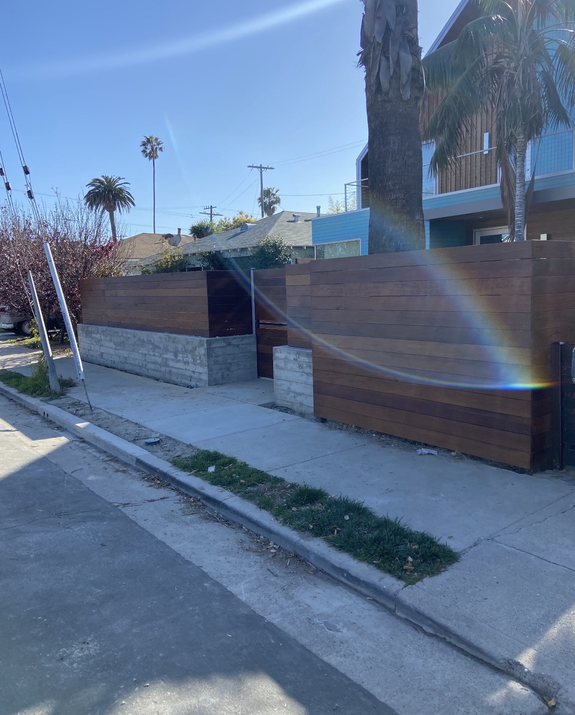 Horizontal hardwood fence above concrete block walls
