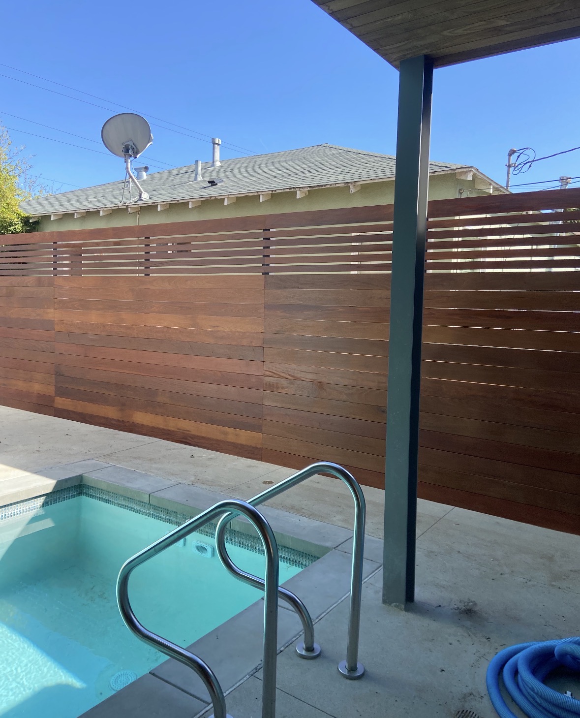 Horizontal wood poolside fence
