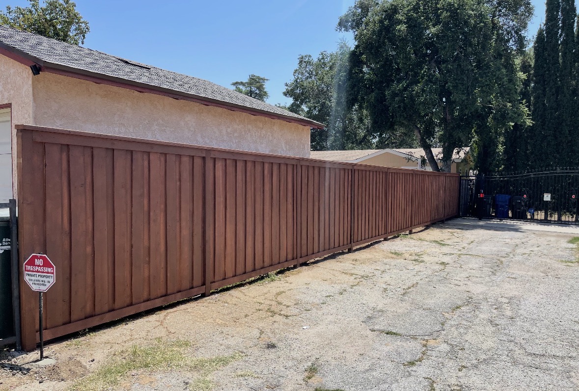 Long vertical wood privacy fence