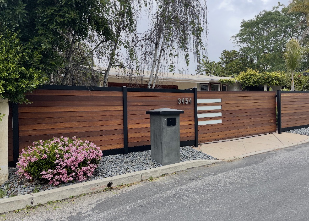 Wood horizontal fence with metal framing and glass accents