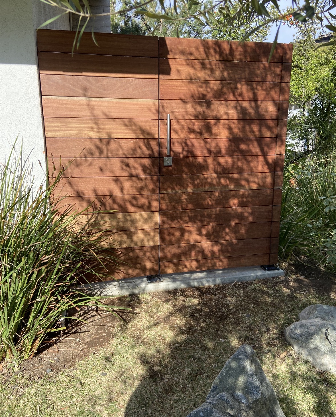 Matching hardwood gate and horizontal privacy wall