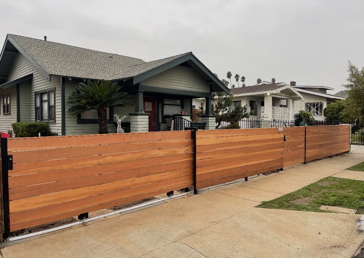 Horizontal wood fence across a Los Angeles front yard